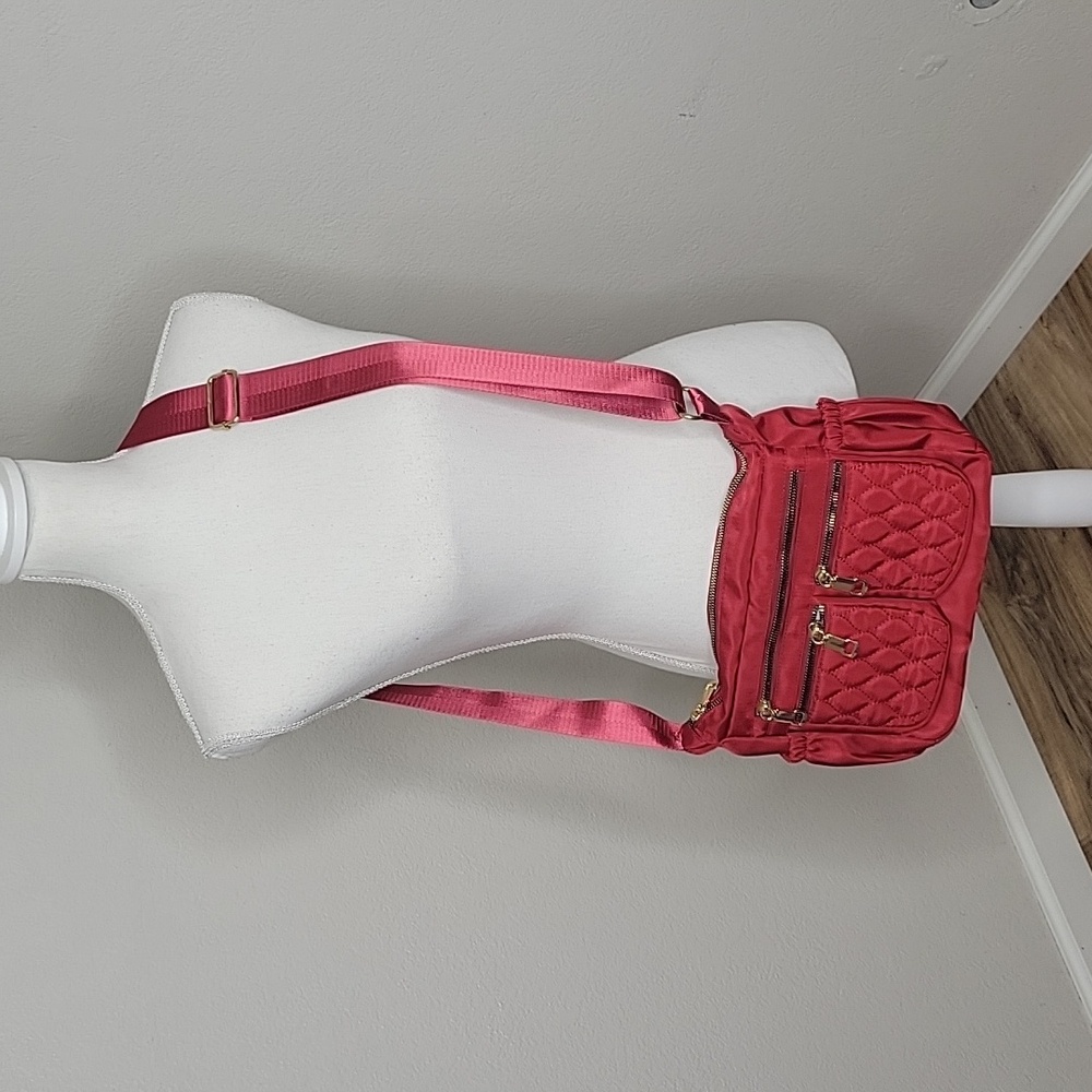 Vibrant Red Crossbody Bag with Adjustable Strap and Gold Zippers
